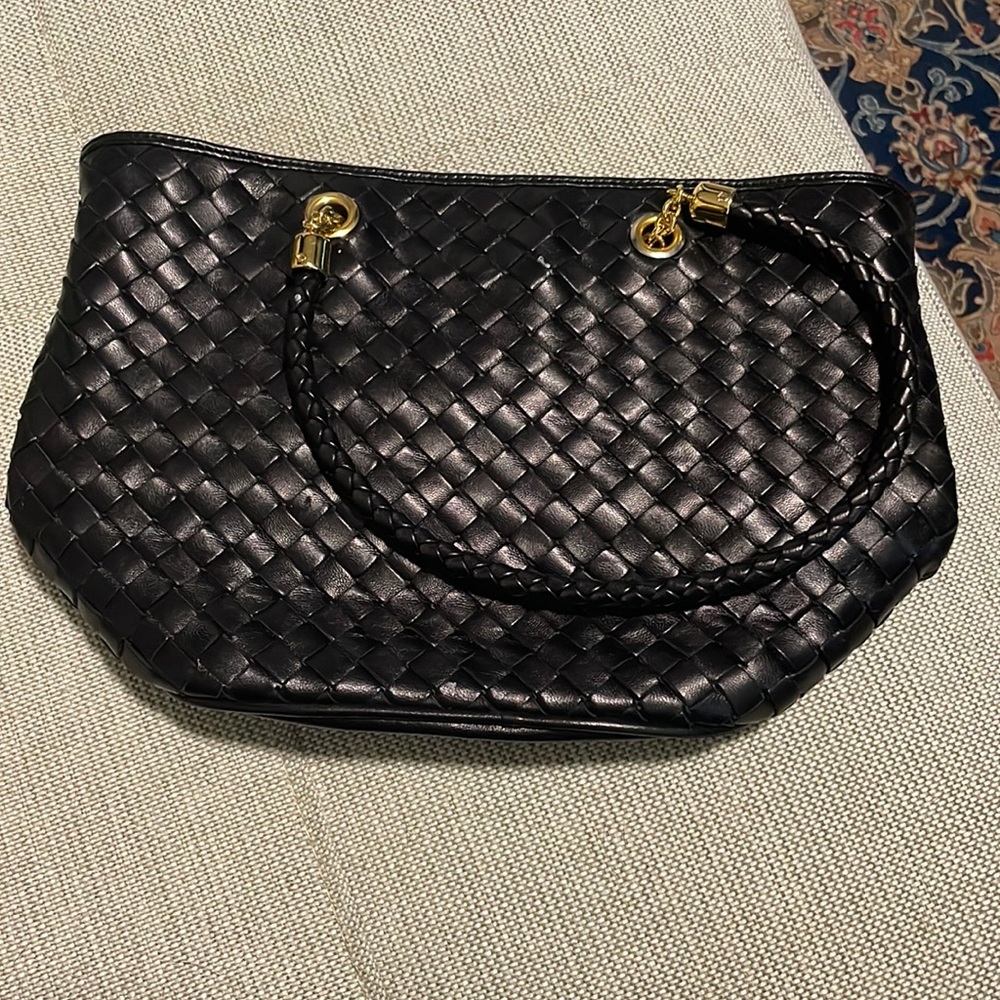 Woven black leather purse